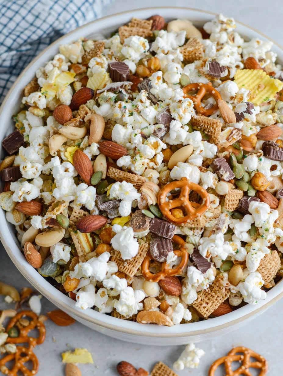 A bowl of popcorn with various toppings.