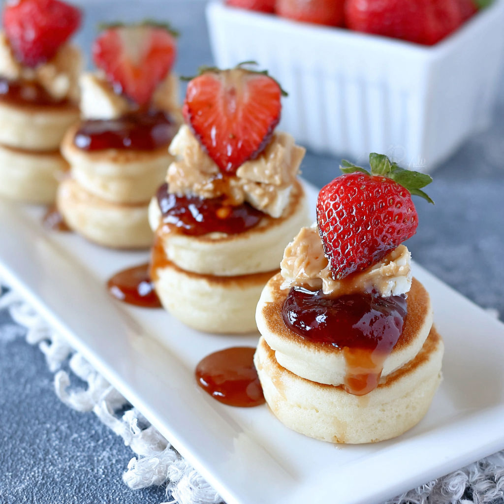 Peanut butter and jelly mini pancake stacks for school lunch.