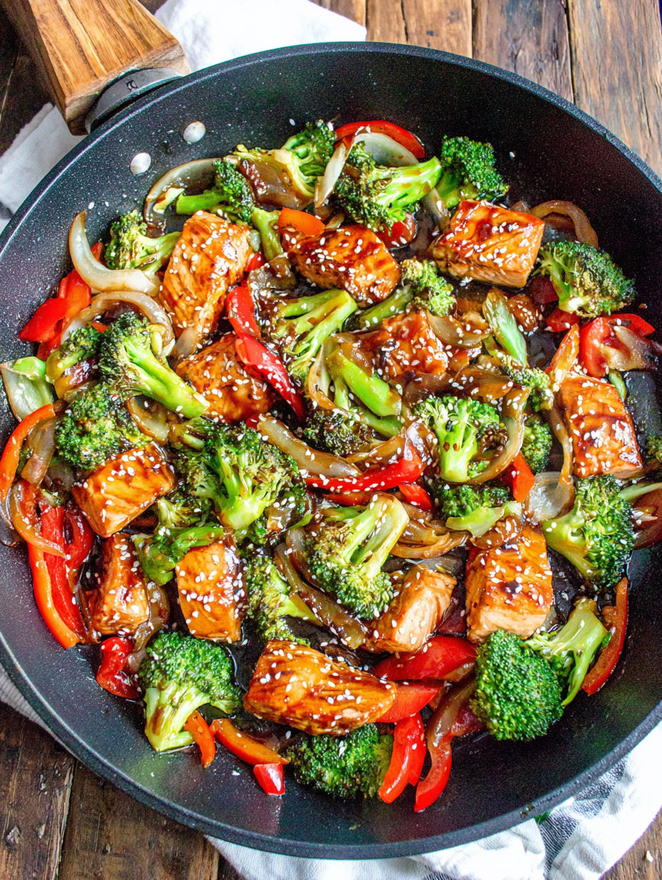 A pan of chicken and broccoli.