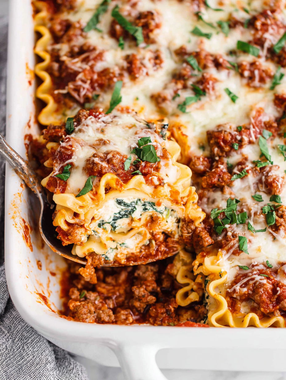 A dish of lasagna roll-ups.