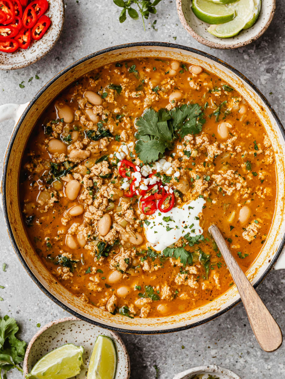 A bowl of chili with white beans and turkey.