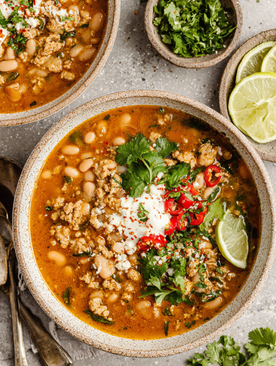 A bowl of turkey and white bean chili.