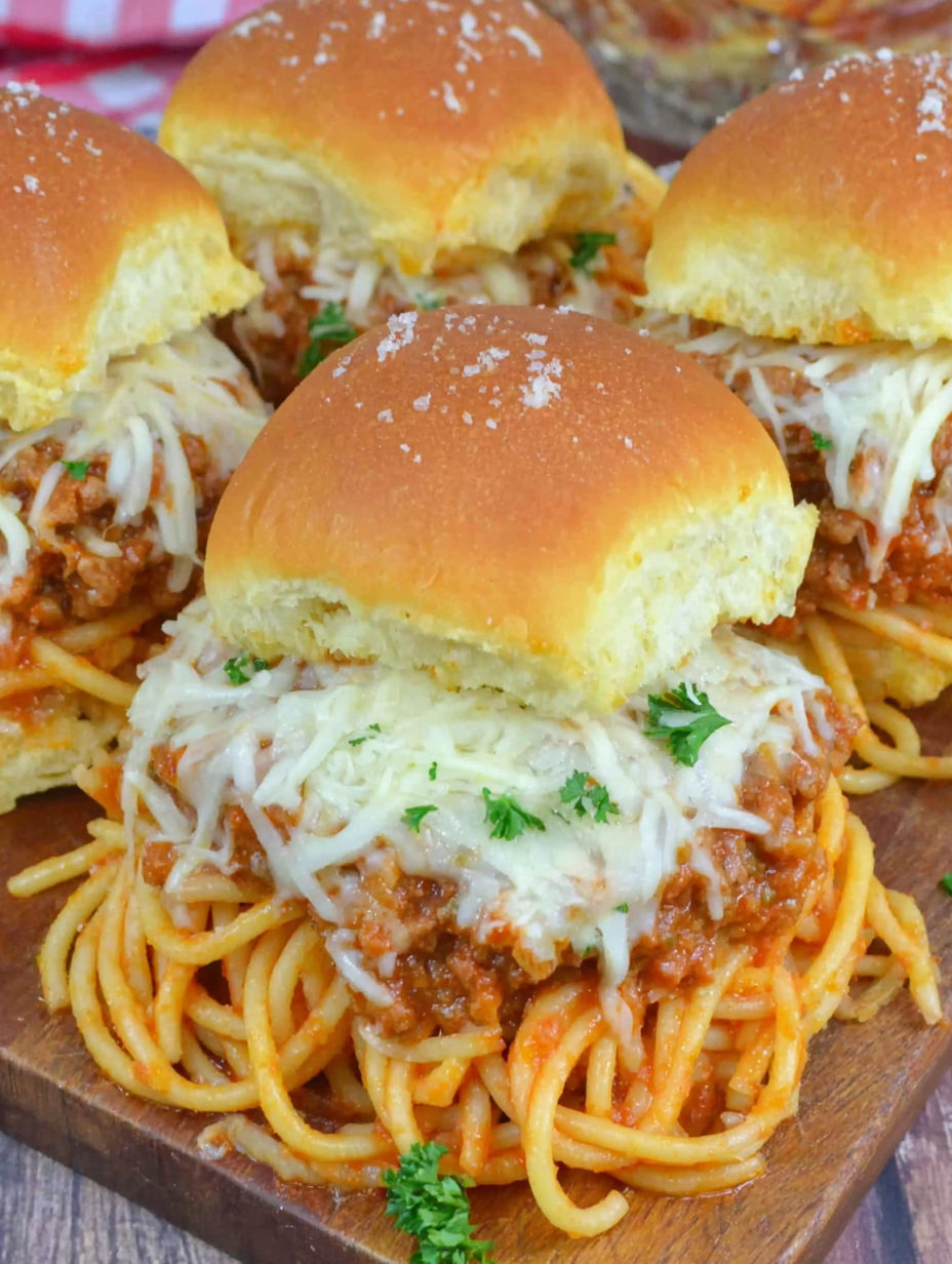 A plate of food with a sandwich and spaghetti.