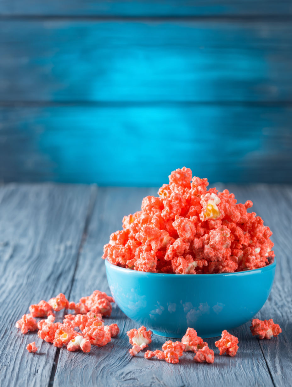 A bowl of red candy-coated popcorn.