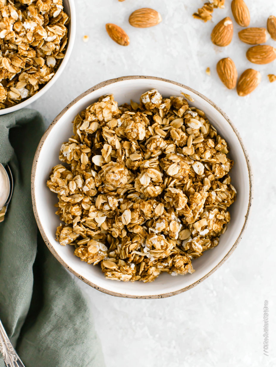 A bowl of granola with nuts and seeds.