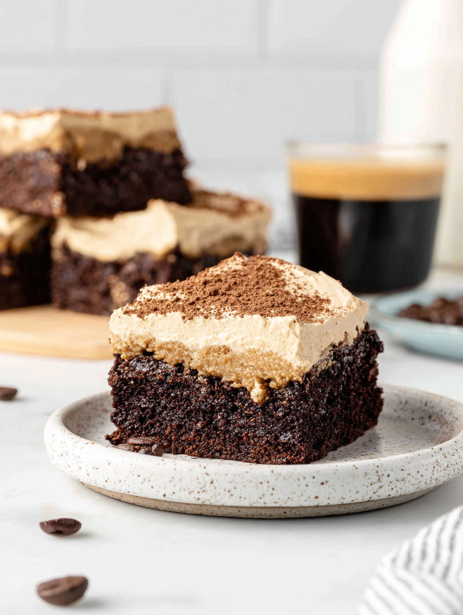 A plate of mocha brownies with cafe latte frosting.