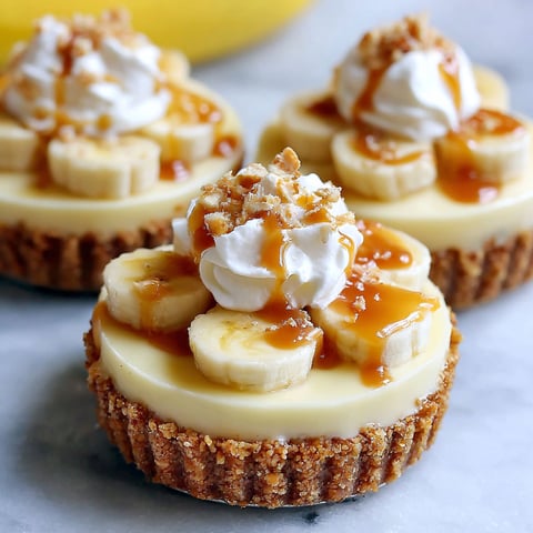 Two desserts with bananas and whipped cream.