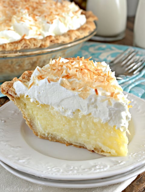 A slice of coconut cream pie on a plate.