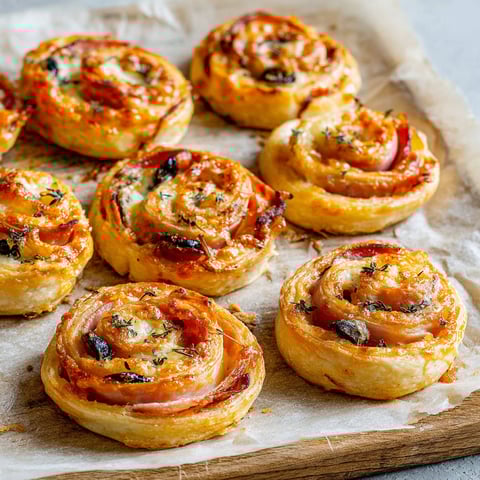 A tray of ham and cheese pinwheels.