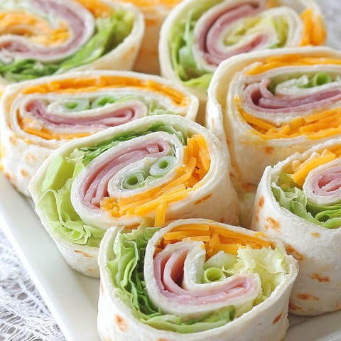 A plate of turkey roll ups.