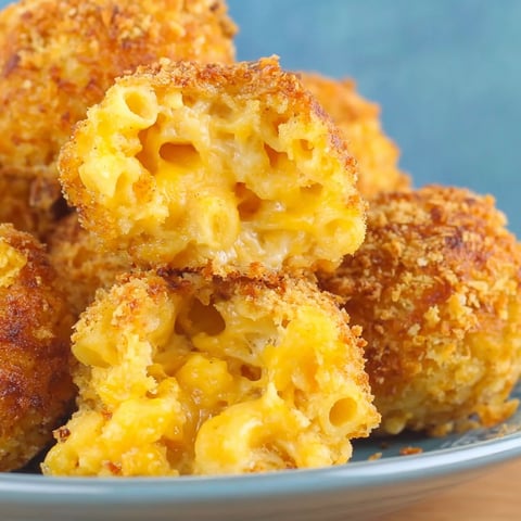 A plate of crispy baked mac and cheese bites.