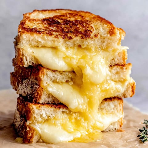A stack of grilled cheese sandwiches.