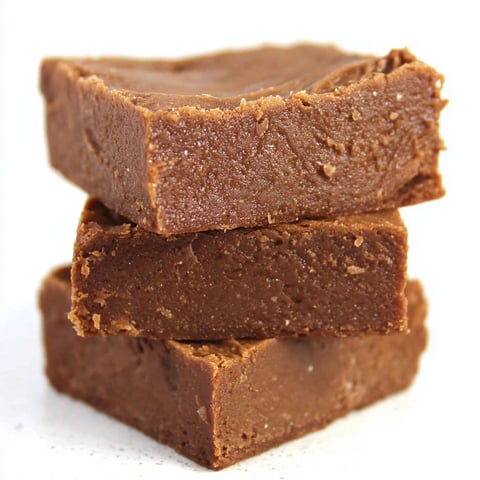 Three stacked brownies made with condensed milk.
