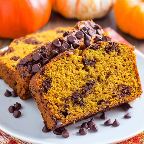 A slice of pumpkin bread with chocolate chips.