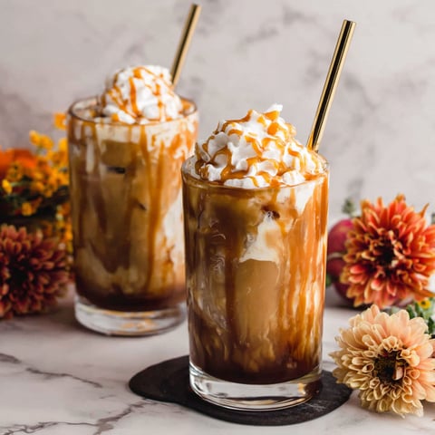 Two glasses of caramel pumpkin spice iced coffee.