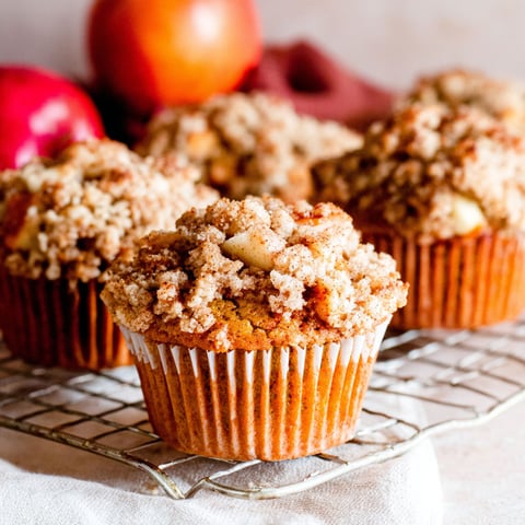Three muffins with a streusel topping.