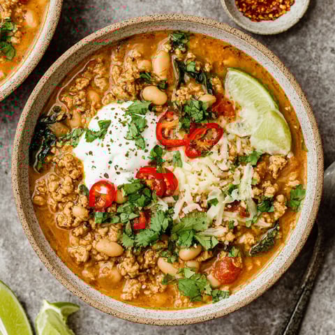 A bowl of turkey and white bean chili.