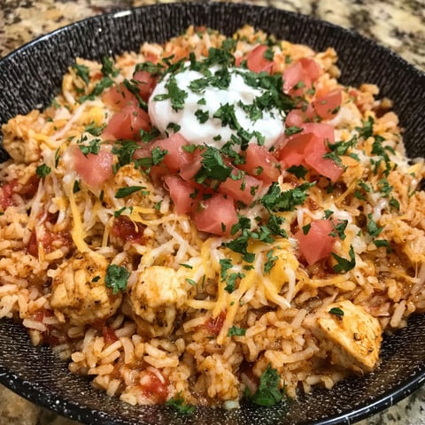 A bowl of cheesy chicken taco rice.